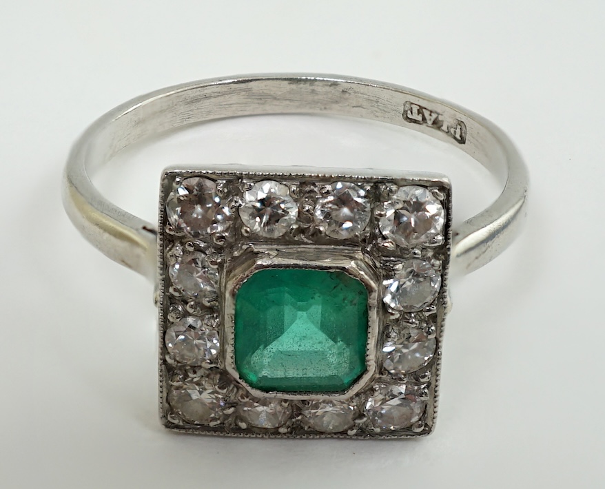 A 1930's/1940's platinum, emerald and diamond cluster set tablet ring